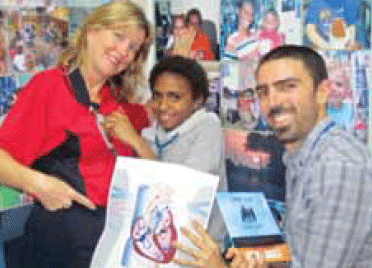 Figure 3. Lisa Smith, an RFDS child health
nurse and author Dr Jason Agostino show
a patient educational material about
rheumatic heart disease