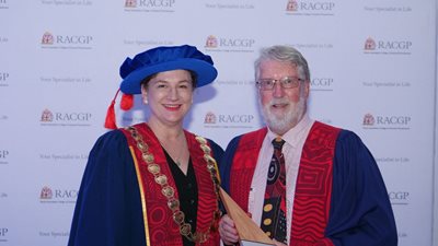 Professor Ross Wilson receiving his award from RACGP President Dr Nicole Higgins at the National Awards Ceremony.